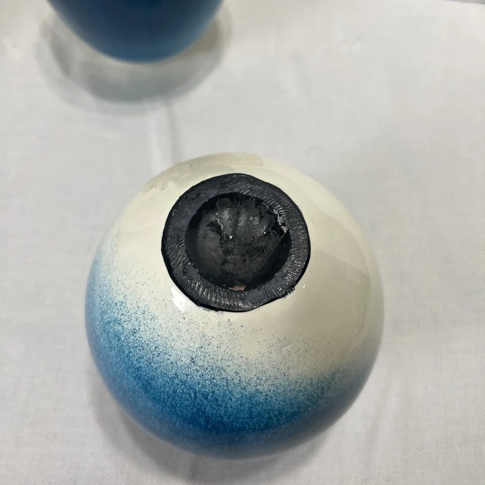 Pair of decorative blue, gold, black and Cream ceramic bottle vases